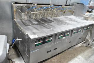 Pitco Frialator SSH60W Stainless Steel Commercial Floor Style Natural Gas Powered 4 Bay Deep Fat Fryer w/ 6 Metal Fry Baskets on Commercial Casters. 100,000 BTU.