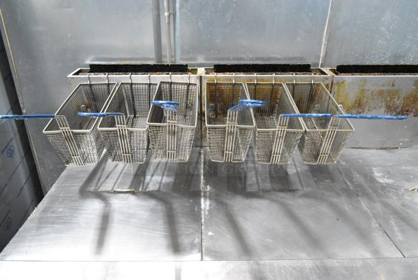 Pitco Frialator SSH60W Stainless Steel Commercial Floor Style Natural Gas Powered 4 Bay Deep Fat Fryer w/ 6 Metal Fry Baskets on Commercial Casters. 100,000 BTU. - Image 3 of 9