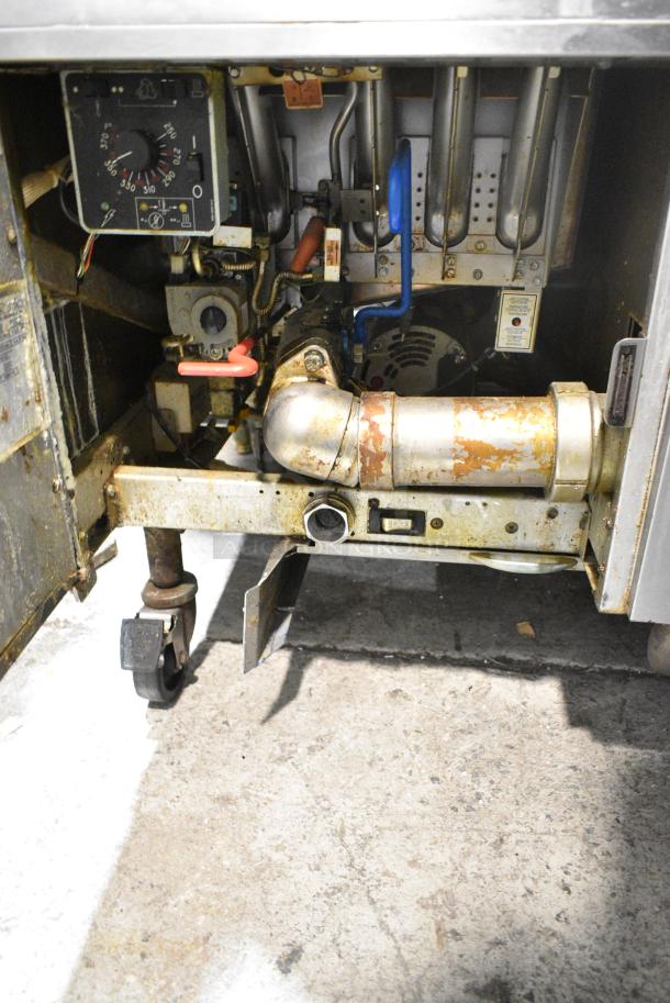 Pitco Frialator SSH60W Stainless Steel Commercial Floor Style Natural Gas Powered 4 Bay Deep Fat Fryer w/ 6 Metal Fry Baskets on Commercial Casters. 100,000 BTU. - Image 6 of 9