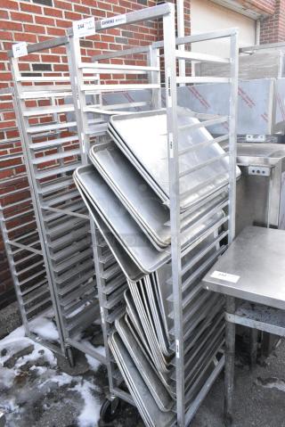 Metal Commercial Pan Transport Rack on Commercial Casters w/ Contents Including 29 Metal Baking Pans.