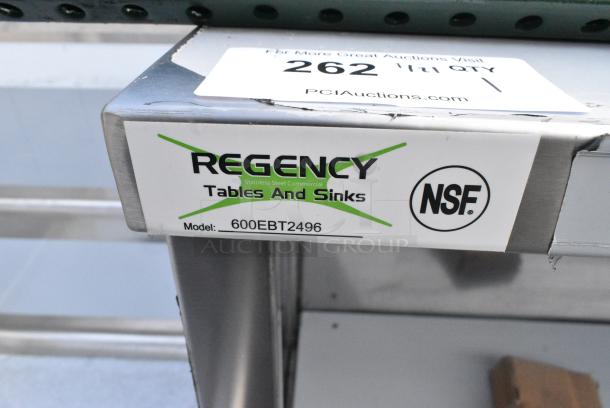 BRAND NEW SCRATCH AND DENT! Regency 600EBT2496 24" x 96" 16 Gauge Type 304 Stainless Steel Enclosed Base Table with Open Front and Adjustable Midshelf - Image 2 of 2