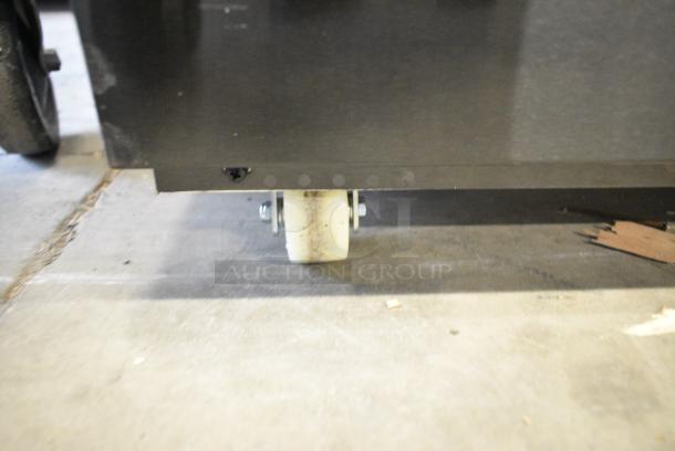 BRAND NEW SCRATCH AND DENT! 2024 Avantco 224BCD60SB 60" Black Square Dry Bakery Display Case Merchandiser on Commercial Casters.  See Pictures for Broken Glass. 115 Volts, 1 Phase. Tested and Powers On But Does Not Get Cold - Image 3 of 8