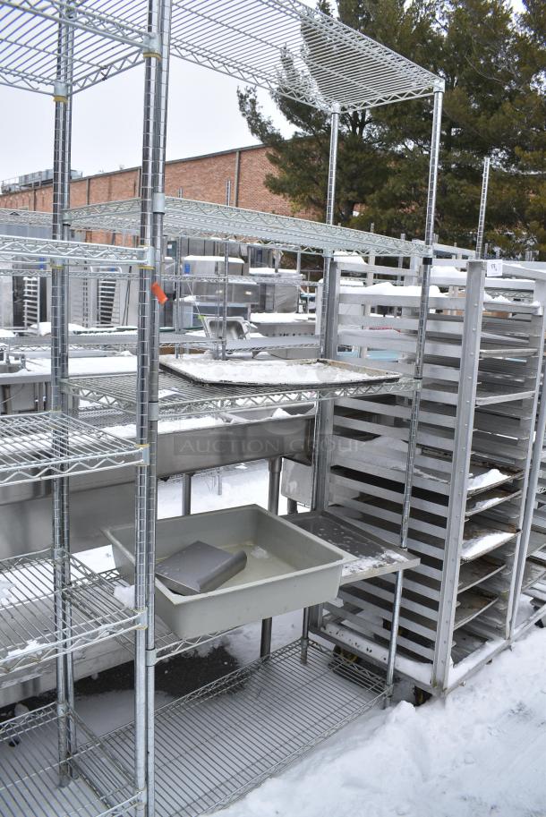 Chrome Finish 5 Tier Wire Shelving Unit w/ Contents. BUYER MUST DISMANTLE. PCI CANNOT DISMANTLE FOR SHIPPING. PLEASE CONSIDER FREIGHT CHARGES. - Image 1 of 4