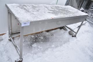 Stainless Steel Table on Commercial Casters.