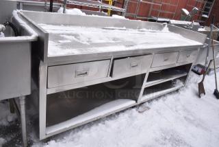 Stainless Steel Table w/ 4 Drawer and Under Shelves.