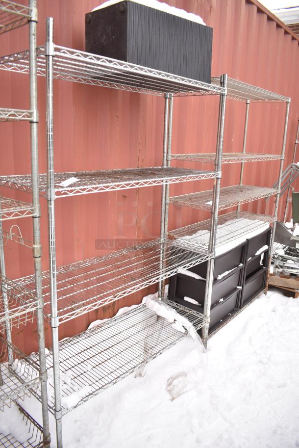 Chrome Finish 4 Tier Wire Shelving Unit w/ Contents. BUYER MUST DISMANTLE. PCI CANNOT DISMANTLE FOR SHIPPING. PLEASE CONSIDER FREIGHT CHARGES. - Image 1 of 5
