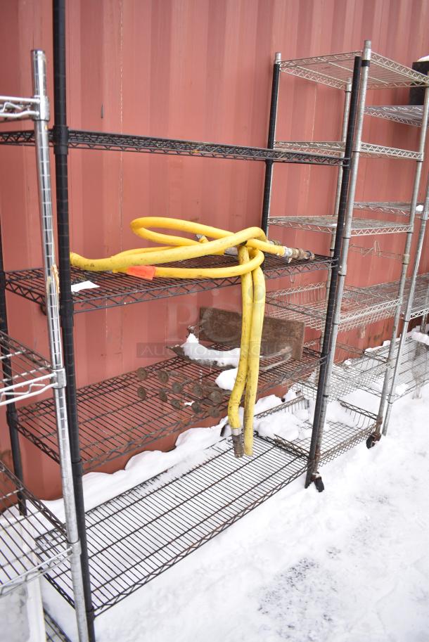 Black Finish 4 Tier Wire Shelving Unit w/ Contents Including Gas Hoses. BUYER MUST DISMANTLE. PCI CANNOT DISMANTLE FOR SHIPPING. PLEASE CONSIDER FREIGHT CHARGES. - Image 1 of 4