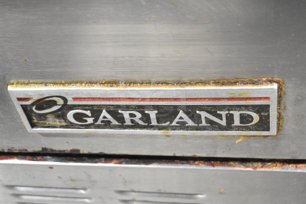 Garland H284-36G Stainless Steel Commercial Propane Gas Powered Flat Top Griddle, 4 Burner Range, 2 Ovens, Over Shelf and Back Splash on Commercial Casters. - Image 2 of 12