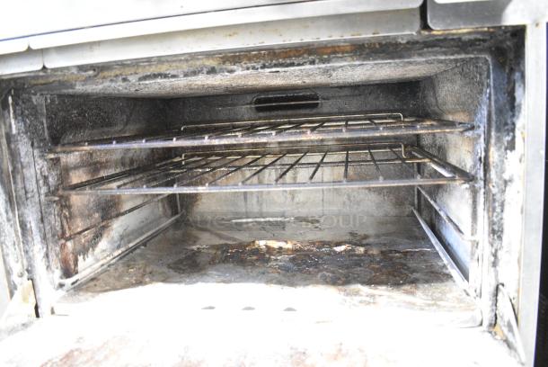 Garland H284-36G Stainless Steel Commercial Propane Gas Powered Flat Top Griddle, 4 Burner Range, 2 Ovens, Over Shelf and Back Splash on Commercial Casters. - Image 9 of 12