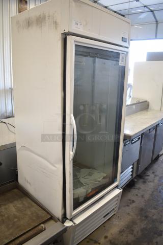 BRAND NEW SCRATCH AND DENT! 2024 True TSCI-600R-G-PH Metal Commercial Single Door Reach In Cooler Merchandiser w/ Poly Coated Racks. 115 Volts, 1 Phases. Tested and Working!
