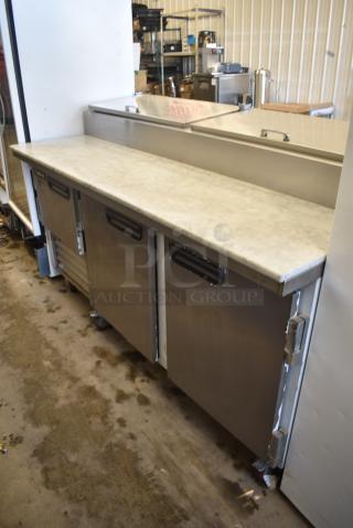2021 Leader ESPT72 Stainless Steel Commercial Pizza Prep Table w/ Oversized Stone Cutting Board on Commercial Casters. 115 Volts, 1 Phases. Tested and Working!