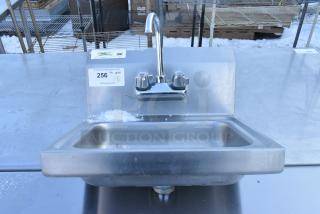 Regency 600HS17Stainless Steel Single Bay Wall Mount Sink w/ Faucet and Handles.