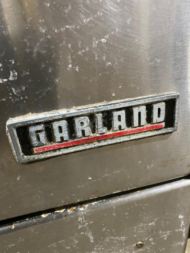 Garland Commercial Stainless Steel Natural Gas Powered 4 Burner Range/Oven Combo! With Back & Right-Side Splash! With Enclosed Type Overhead Salamander Shelf! On Casters! - Image 8 of 10