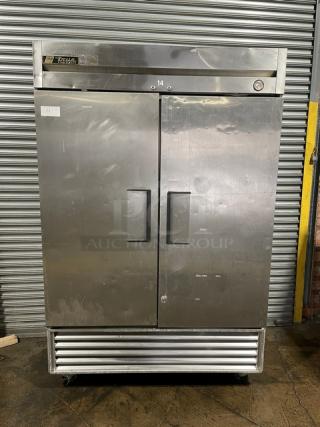 True Commercial Stainless Steel Solid 2 Door Reach In Freezer! With Poly Coated Wire Racks! Model: T-49 SN: 1-3548796! 115V 1 Phase! On Casters!