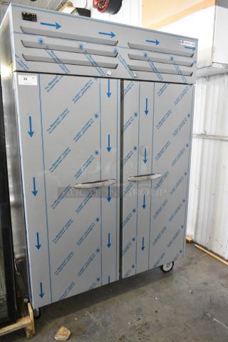 BRAND NEW SCRATCH AND DENT! Beverage Air TMR2HC-1S Stainless Steel Commercial 2 Door Reach In Cooler w/ Poly Coated Racks on Commercial Casters. 115 Volts, 1 Phase. Tested and Working!