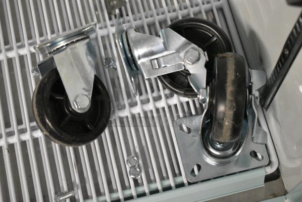 BRAND NEW SCRATCH AND DENT! 2024 Avantco 178GDC23HCB Metal Commercial Single Door Reach In Cooler Merchandiser w/ Poly Coated Racks and Commercial Casters. 115 Volts, 1 Phase. Tested and Powers On But Does Not Get Cold - Image 5 of 6