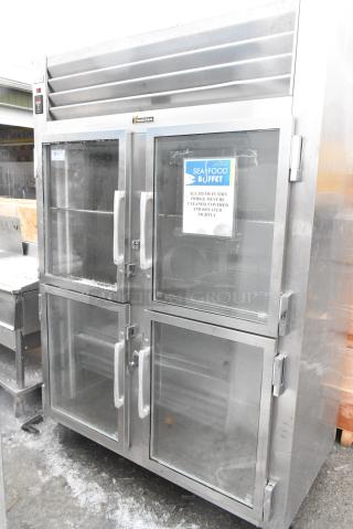 BRAND NEW SCRATCH AND DENT! Traulsen RHT232WUT-HHG Stainless Steel Commercial 58" 2 Section 4 Door Reach In Refrigerator Merchandiser on Commercial Casters. 115 Volts, 1 Phase.