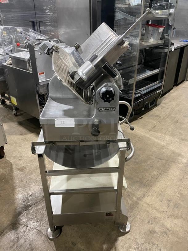 GREAT! Hobart Commercial Heavy Duty Electric Powered Countertop Deli Meat Slicer! Model: 1712E SN: 56-932-680! 115V 1 Phase! On Face-To-Face Commercial Stainless Steel Equipment Cart/Stand! With Legs & Casters! - Image 1 of 10