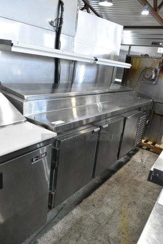 Kairak KBP-91S Stainless Steel Commercial Pizza Prep Table w/ Over Shelf on Commercial Casters. 115 Volts, 1 Phase. Tested and Powers On But Does Not Get Cold