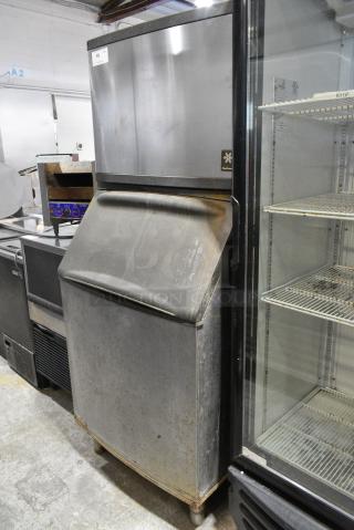 Manitowoc QY0604A Stainless Steel Commercial Ice Machine Head on Commercial Ice Bin. 208/230 Volts, 1 Phase.