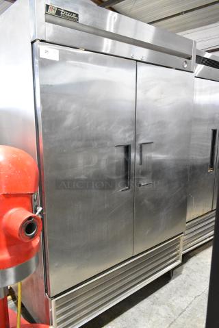 True T-49F Stainless Steel Commercial 2 Door Reach In Freezer w/ Poly Coated Racks on Commercial Casters. 115 Volts, 1 Phase. Tested and Working!