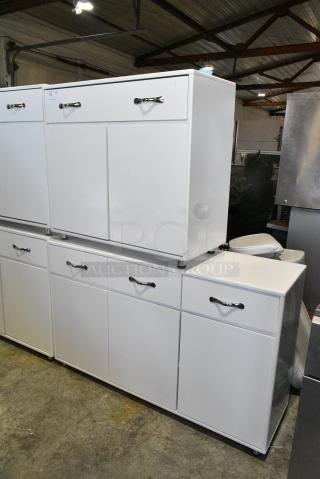 2 White Counters; 1 w/ Drawer and 2 Doors and 1 w/ Drawer and 3 Doors. 2 Times Your Bid!