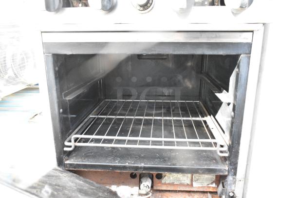 American Range Stainless Steel Commercial Gas Powered 4 Burner Range w/ Oven and Back Splash on Commercial Casters. - Image 6 of 8