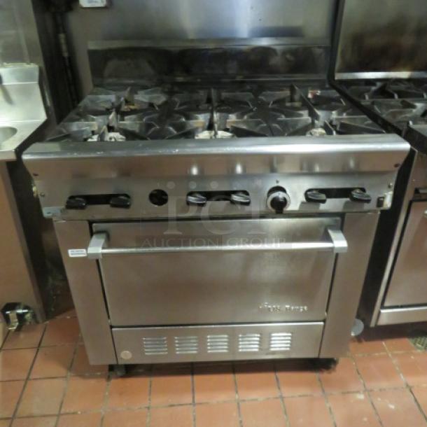 One US Range Natural Gas 6 Burner/Convection Oven With 2 Racks On Casters. Model# PS-6-26RC. 36X23X43. Tested And Working. - Image 1 of 5
