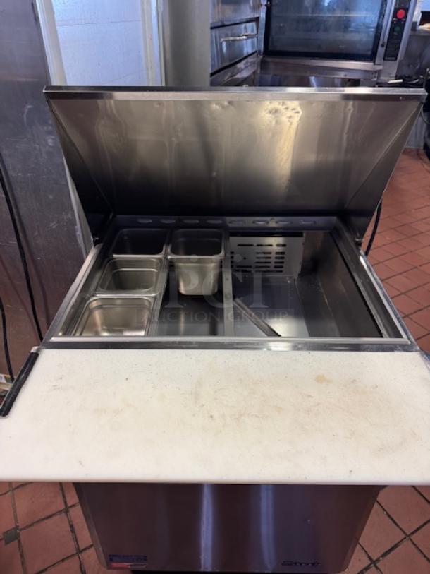 One Turbo Air 1 Door Refrigerated Prep Table On Casters. Model# MST-28-12-N. 115 Volt. 27.5X38X45. $2799.38 - Image 2 of 2