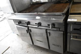 Vulcan VCB136 Stainless Steel Commercial Natural Gas Powered Charbroiler Grill w/ 3 Doors and Under Shelf.