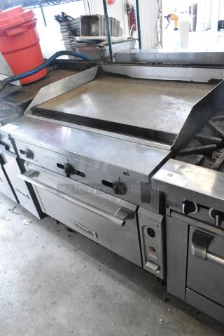 Vulcan Stainless Steel Commercial Natural Gas Powered Flat Top Griddle w/ Oven on Commercial Casters.