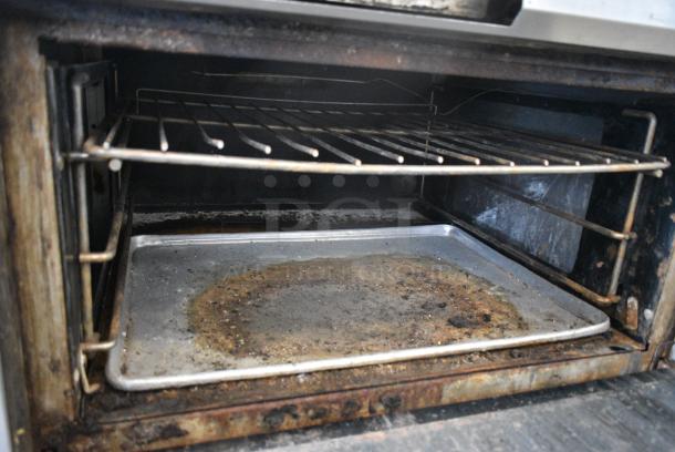 Vulcan Stainless Steel Commercial Natural Gas Powered Flat Top Griddle w/ Oven on Commercial Casters. - Image 7 of 8