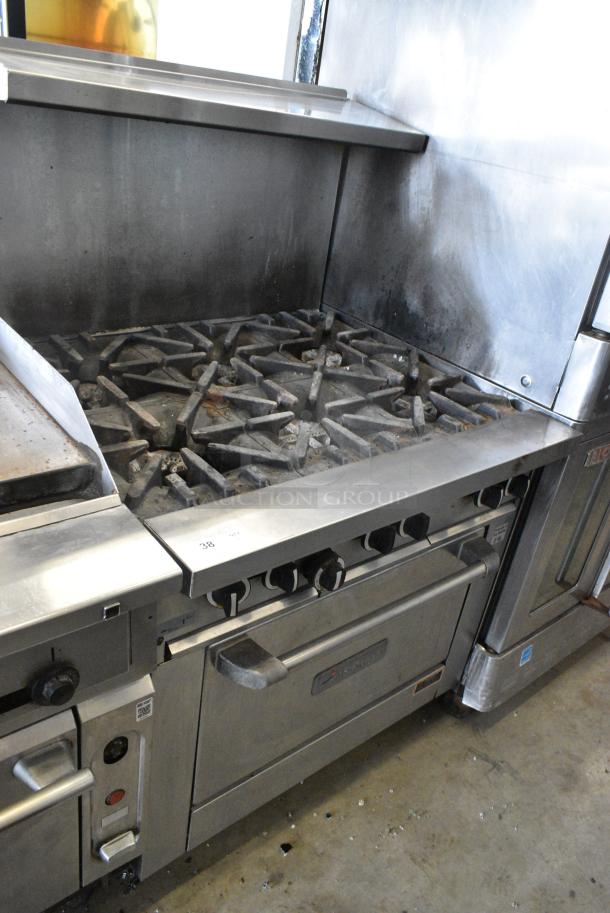 US Range U36-6R Stainless Steel Commercial Natural Gas Powered 6 Burner Range w/ Oven, Over Shelf and Back Splash on Commercial Casters. - Image 1 of 8