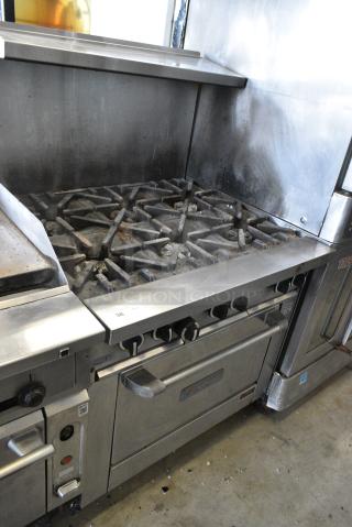 US Range U36-6R Stainless Steel Commercial Natural Gas Powered 6 Burner Range w/ Oven, Over Shelf and Back Splash on Commercial Casters.