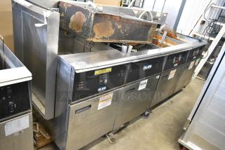 Giles EOF-24 Stainless Steel Commercial Electric Powered 3 Bay Deep Fat Fryer w/ Dumping Station on Commercial Casters. 480 Volts, 3 Phase.