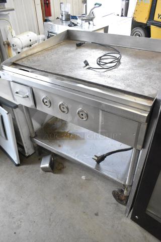 Stainless Steel Commercial Flat Top Griddle w/ Under Shelf on Commercial Casters. 220-240 Volts, 3 Phase.
