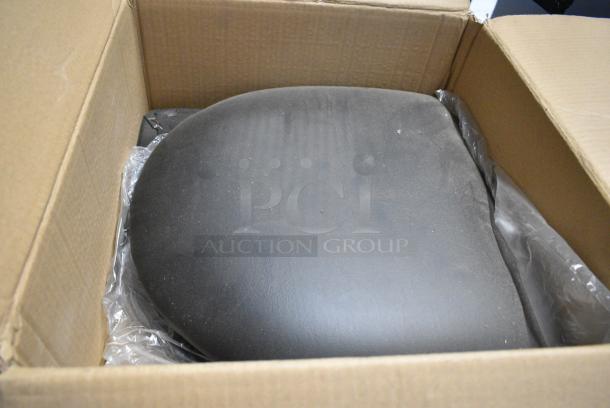 BRAND NEW! Box of 4 American Chair Company Black Vinyl Seat Cushions. - Image 1 of 4