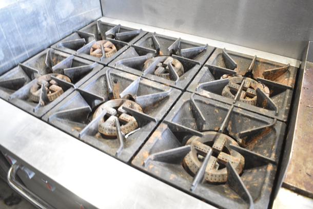 Stainless Steel Commercial Natural Gas Powered 6 Burner Range w/ Right Side Flat Top Griddle, 2 Ovens and Back Splash. - Image 4 of 10