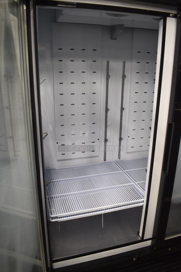 BRAND NEW SCRATCH AND DENT! 2024 Migali C-49FM-HCe Metal Commercial 2 Door Reach In Freezer Merchandiser w/ Poly Coated Racks on Commercial Casters. 115 Volts, 1 Phase. Serial C-49FM-HCe240430C014. Tested and Working! - Image 4 of 7