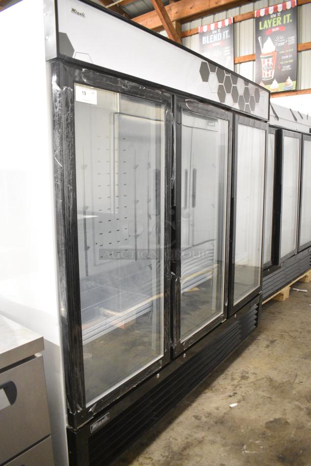 BRAND NEW SCRATCH AND DENT! 2024 Migali C-72FM-HC Metal Commercial 3 Door Freezer Merchandiser w/ Poly Coated Racks on Commercial Casters. 115/208-230 Volts, 1 Phase. Serial C-72FM-HCN6NT011. - Image 2 of 9