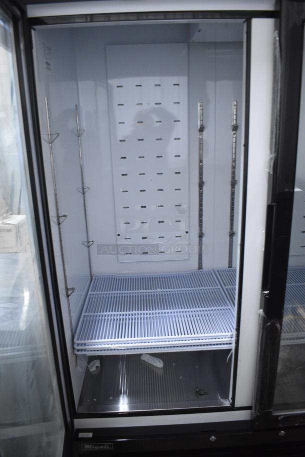 BRAND NEW SCRATCH AND DENT! 2024 Migali C-72FM-HC Metal Commercial 3 Door Freezer Merchandiser w/ Poly Coated Racks on Commercial Casters. 115/208-230 Volts, 1 Phase. Serial C-72FM-HCN6NT011. - Image 6 of 9