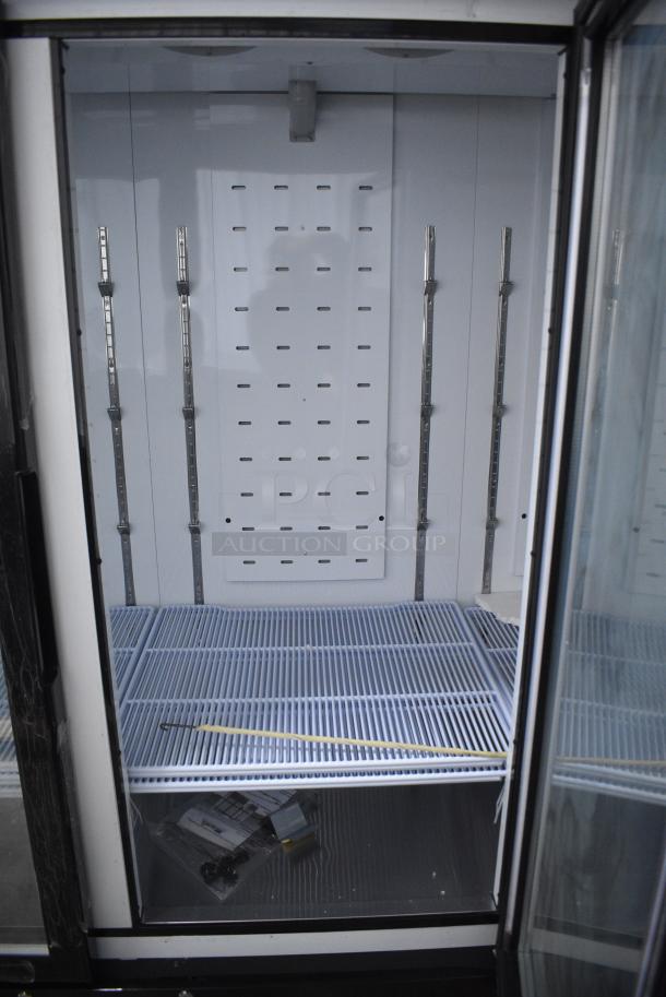 BRAND NEW SCRATCH AND DENT! 2024 Migali C-72FM-HC Metal Commercial 3 Door Freezer Merchandiser w/ Poly Coated Racks on Commercial Casters. 115/208-230 Volts, 1 Phase. Serial C-72FM-HCN6NT011. - Image 7 of 9