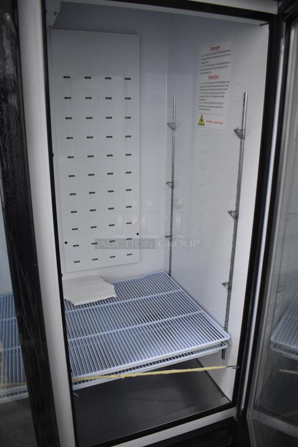 BRAND NEW SCRATCH AND DENT! 2024 Migali C-72FM-HC Metal Commercial 3 Door Freezer Merchandiser w/ Poly Coated Racks on Commercial Casters. 115/208-230 Volts, 1 Phase. Serial C-72FM-HCN6NT011. - Image 8 of 9