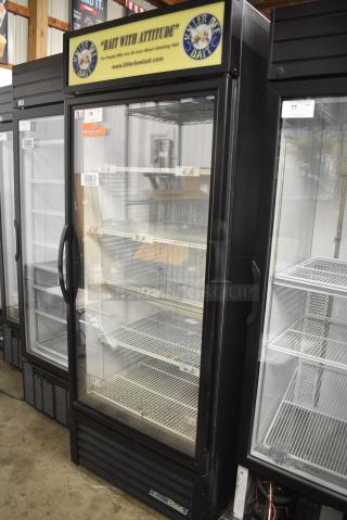 2017 True GDM-26F-HC Metal Commercial Single Door Reach In Freezer Merchandiser w/ Poly Coated Racks. 115 Volts, 1 Phase. Tested and Does Not Power On