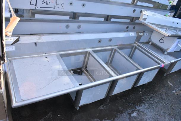 BRAND NEW SCRATCH AND DENT! Regency 600S3182424L 84 1/2" 16-Gauge Stainless Steel Three Compartment Commercial Sink with Cross Bracing and 1 Drainboard - 18" x 24" x 14" Bowls - Left Drainboard. No Legs. - Image 1 of 7