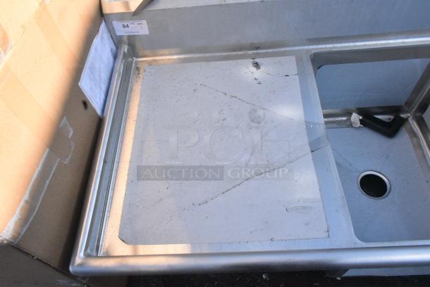 BRAND NEW SCRATCH AND DENT! Regency 600S3182424L 84 1/2" 16-Gauge Stainless Steel Three Compartment Commercial Sink with Cross Bracing and 1 Drainboard - 18" x 24" x 14" Bowls - Left Drainboard. No Legs. - Image 6 of 7