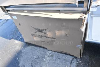 BRAND NEW SCRATCH AND DENT! Regency 600EBT3048D 30" x 48" 16 Gauge Type 304 Stainless Steel Enclosed Base Table with Sliding Doors and Adjustable Midshelf