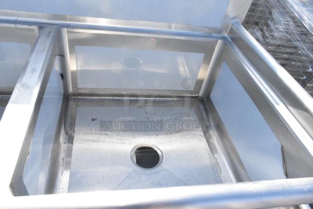 BRAND NEW SCRATCH AND DENT! Regency 600S22323 96" 16-Gauge Stainless Steel Two Compartment Commercial Sink with Stainless Steel Legs, Cross Bracing, and 2 Drainboards - 23" x 23" x 12" Bowls. No Legs. - Image 3 of 5