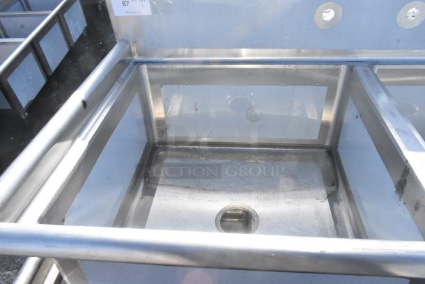 BRAND NEW SCRATCH AND DENT! Regency 600S22323 96" 16-Gauge Stainless Steel Two Compartment Commercial Sink with Stainless Steel Legs, Cross Bracing, and 2 Drainboards - 23" x 23" x 12" Bowls. No Legs. - Image 4 of 5