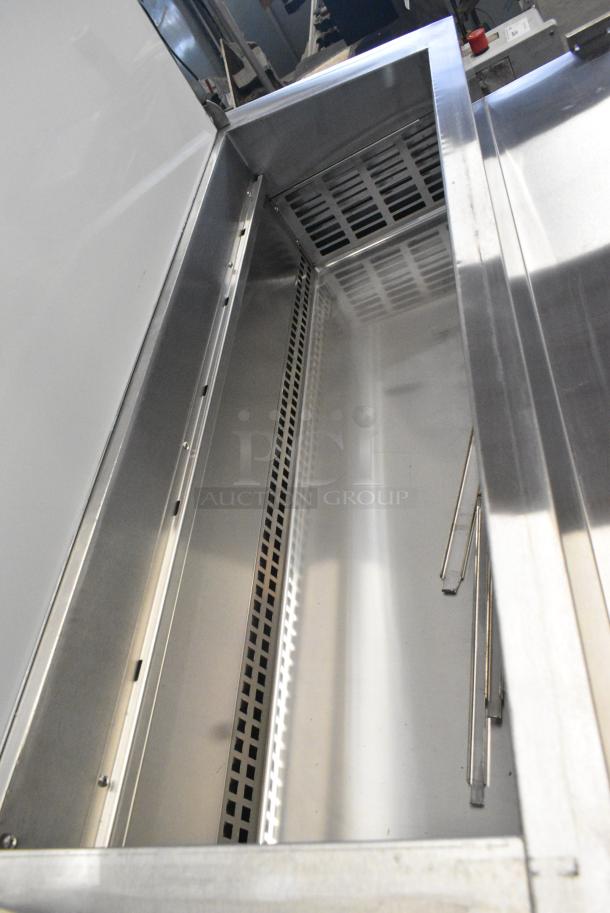 BRAND NEW SCRATCH AND DENT! 2024 Avantco 178SSPPT3 Stainless Steel Commercial 94" 3 Door Refrigerated Pizza Prep Table w/ 4 Drawers and 1 Door on Commercial Casters. 115 Volts, 1 Phase. Tested and Working! - Image 6 of 14